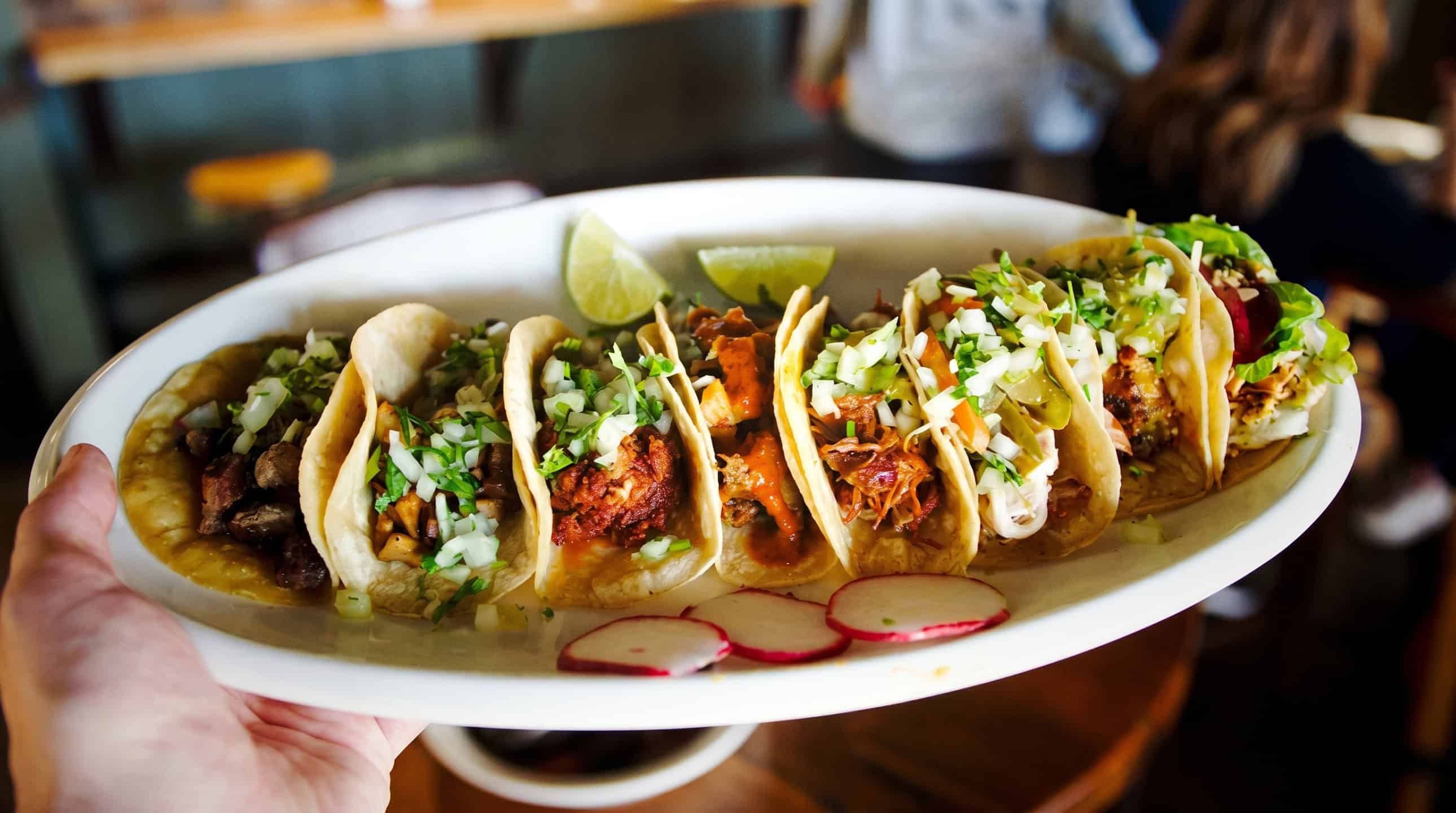 Hearty Mexican plate with rice, beans, and tacos